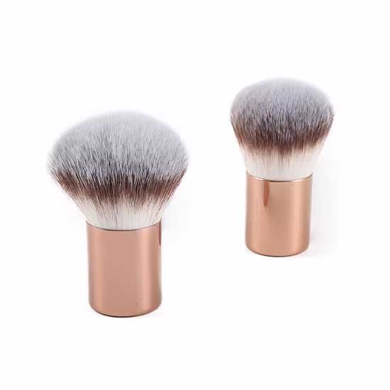 Brocha facial Kabuki de oro rosa para brocha de maquillaje en polvo con punteado mineral